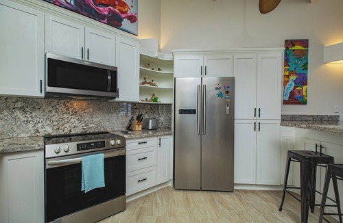 Teagues Bay Condo | East End Villa Located on Golf Course - Hilltop Pool